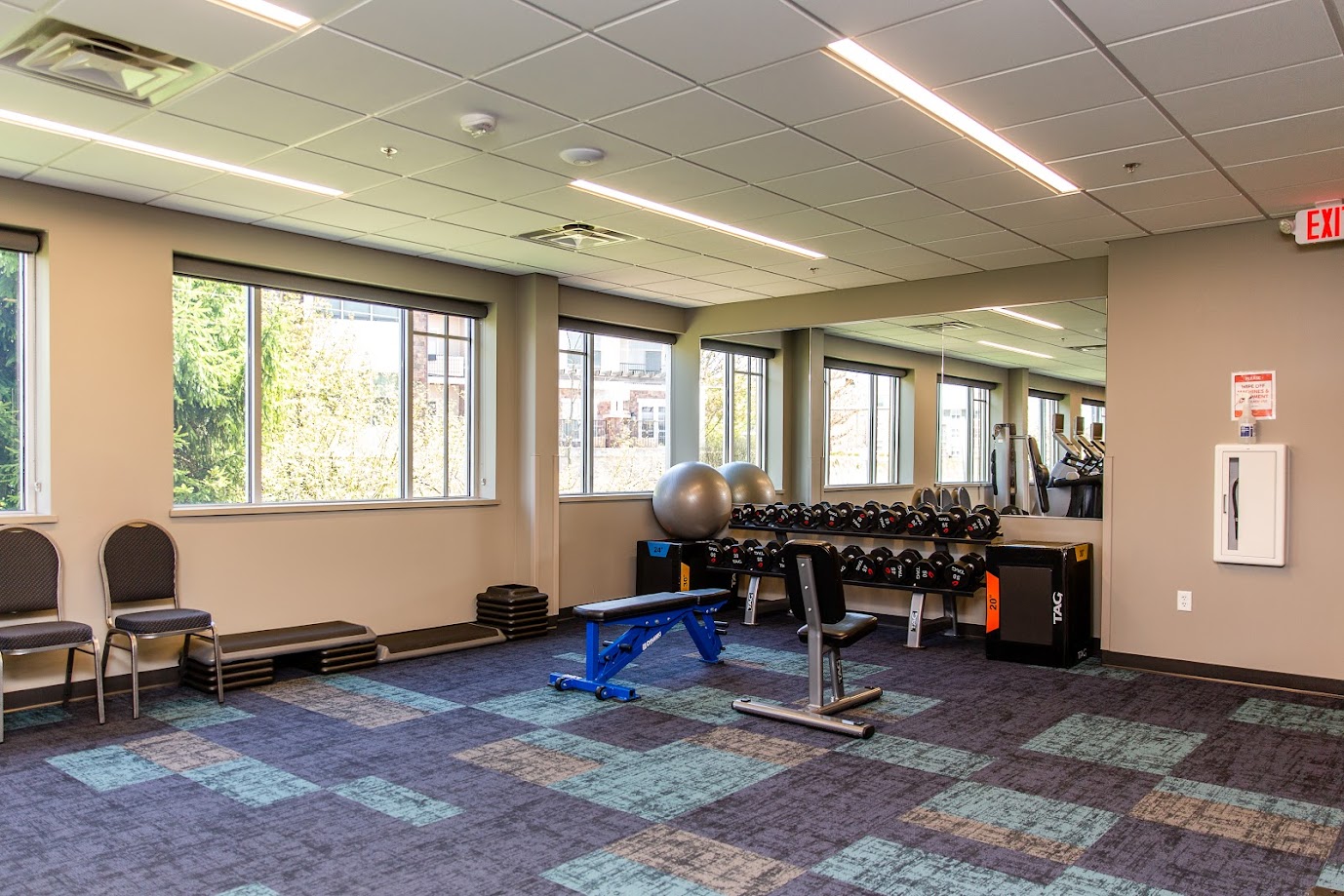 New-Berlin_Corner of room with weights and weight benches