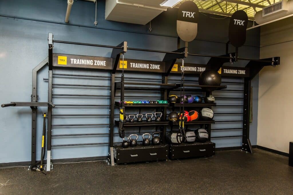 Southwest_TRX Training Zone wall with various weights and medicine balls